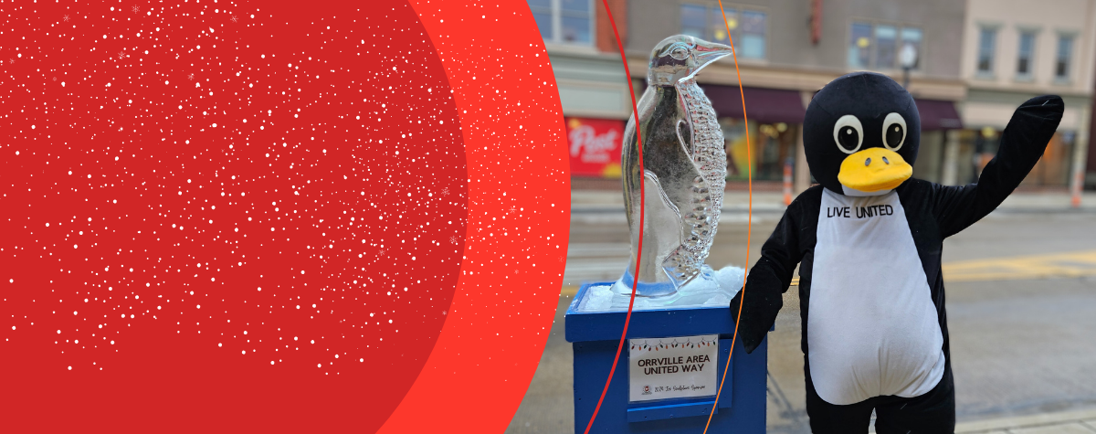 Percy the Penguin with a Home for the Holidays ice sculpture